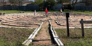 Children walking through a labyrinth near the author's home